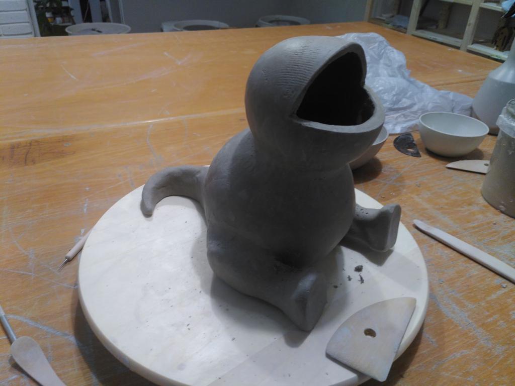 The basic body of a very round reptile-like figure.
It lacks arms, but has a tail and very round legs and near spherical body and head.