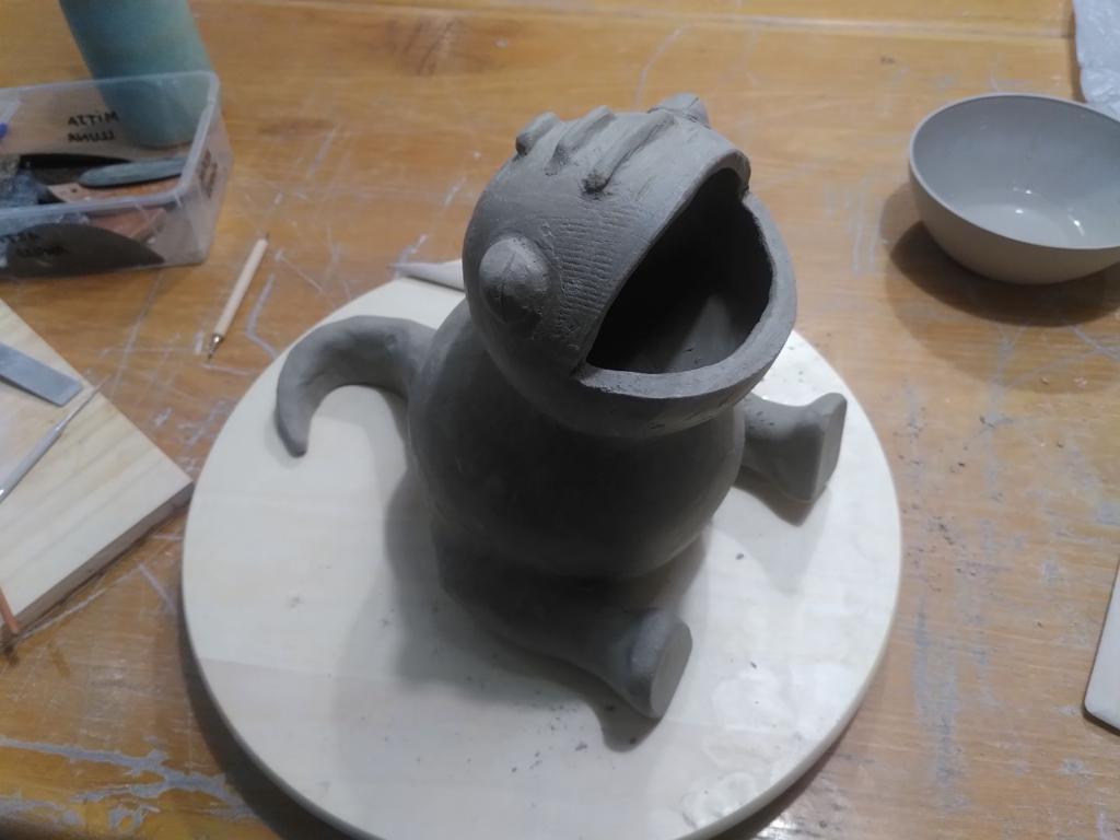 The same figure, except it now even has eyes and many more details around the head and legs.