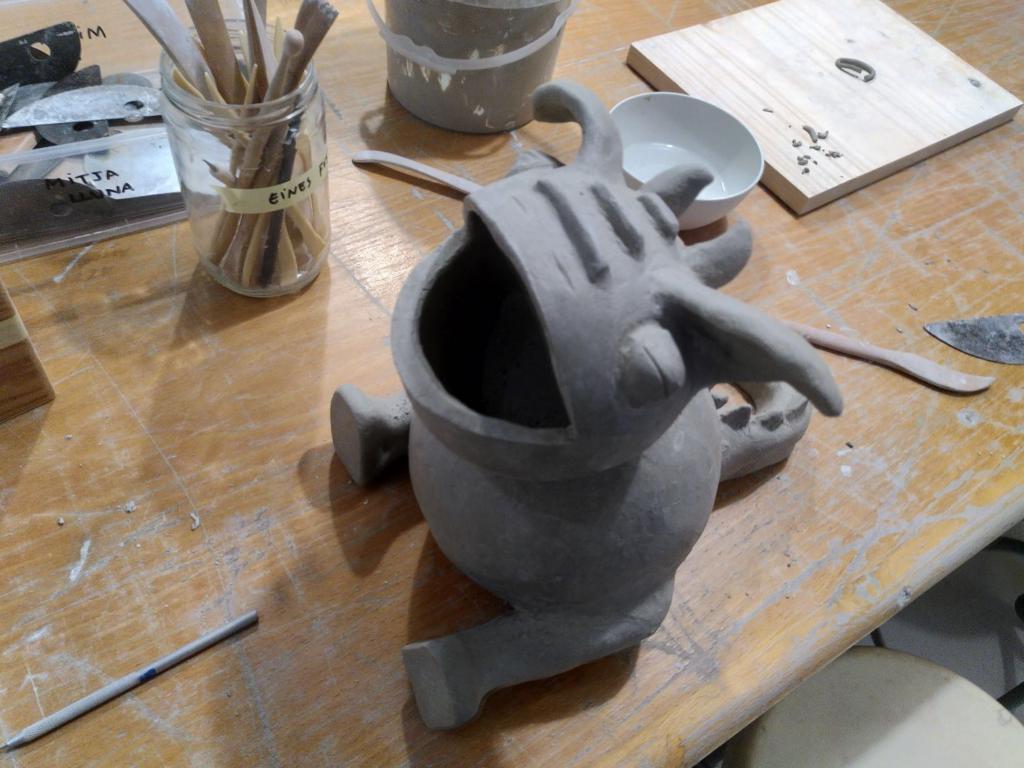 The cute dragon from a top right angle and still lacking arms and some detail.