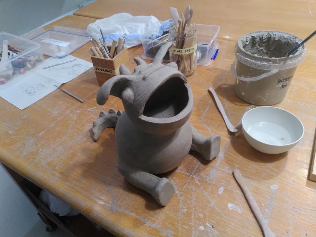 The cute dragon from a top left angle and still lacking arms and some detail.