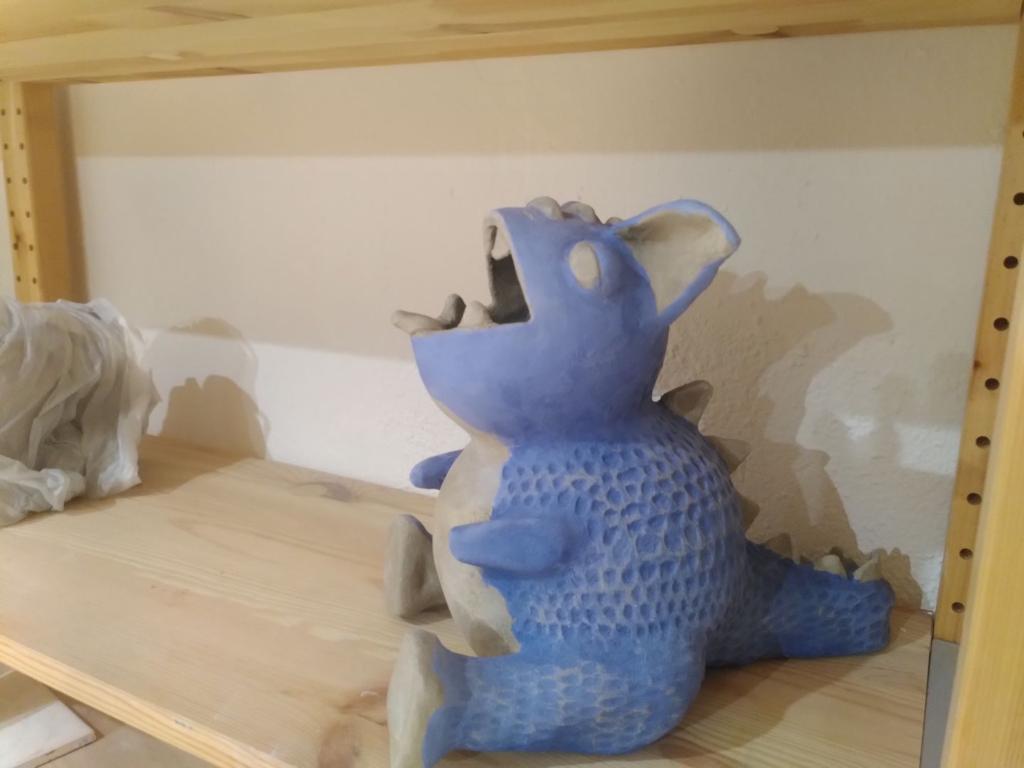 Picture of the cute round dragon before going through the oven.
This is leather-hard and painted with blue slip.