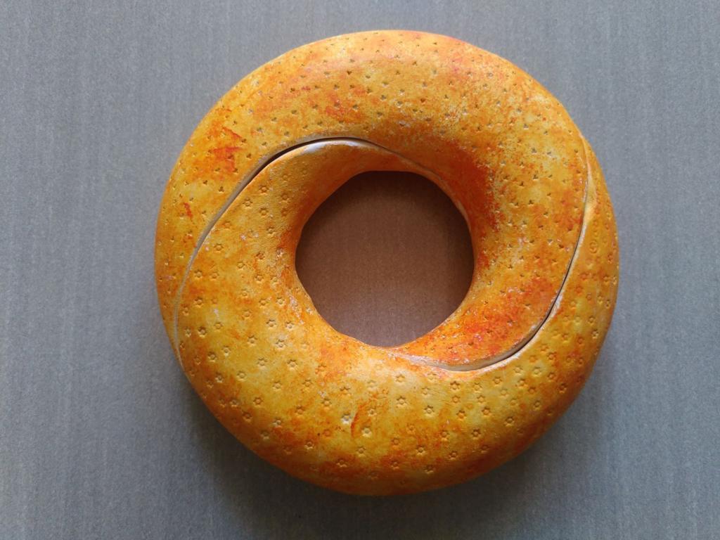 The doughnut, closed. Upon superficial observation, one wouldn't necessarily think it opens up in the, rather spectacular fashion, it does.