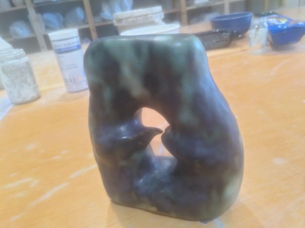 The pointed oval after glaze fire (black-green gradients), this angle shows the stress of the two parts trying to reach each other.