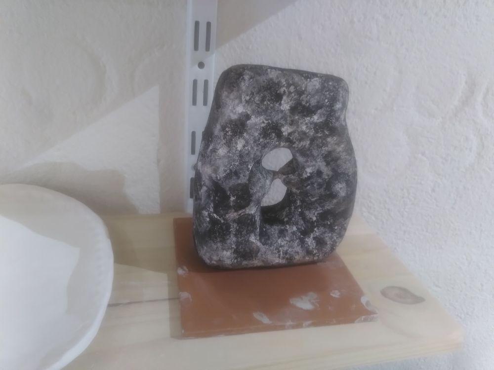 Before glaze fire, it looks like a white base with some black ink applied with sponge.

The "ink" is in fact copper oxide.