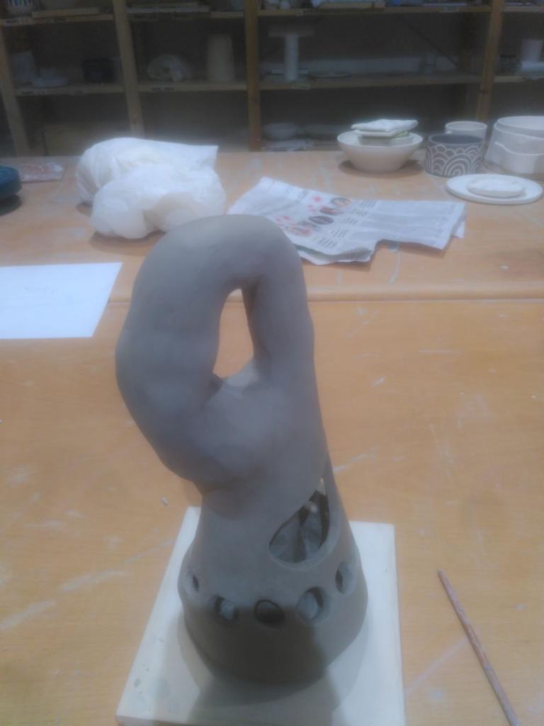 The Klein bottle pointing at 2 o'clock, we further see how "inside" and "outside" blend together.