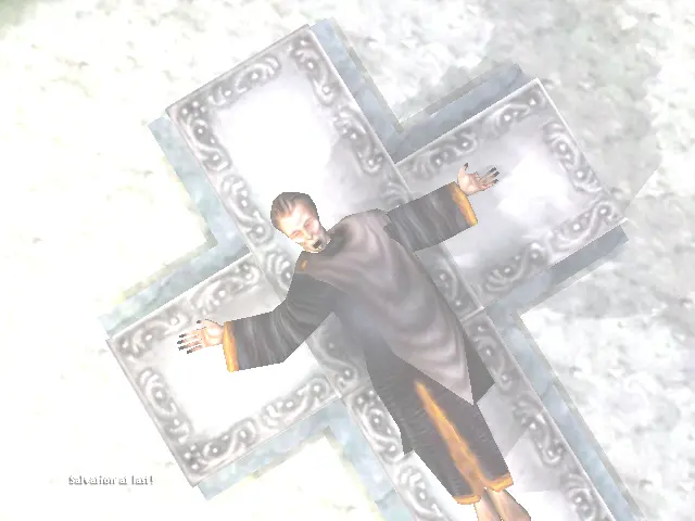 Luther Black, estirat i lligat a la seva creu, amb molta llum solar a sobre.